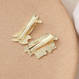 Detailed back view of gold rabbit and leaf hair clips with anti-slip alligator grip