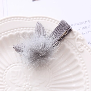 Plush bunny ear hair clip in grey faux fur with a soft fabric-covered duckbill base