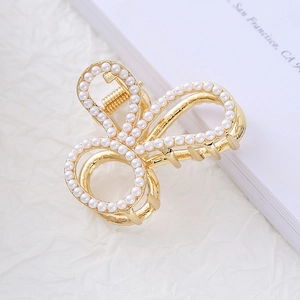 Elegant gold claw clip with heart shape and pearls for high ponytail hairstyles