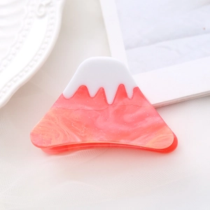 Pink Mount Fuji hair claw clip with marble texture and white snow-capped peak design