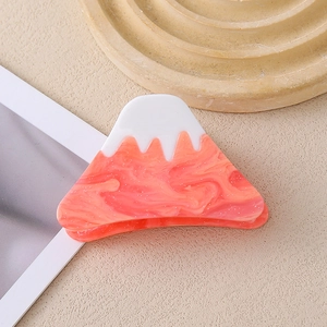 Detailed macro view of Mount Fuji shaped acetate hair claw with pink marble texture
