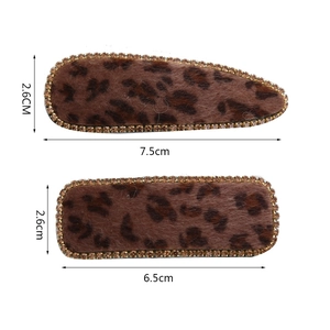 Detailed view of leopard velvet hair clips with crystal trim and size measurements