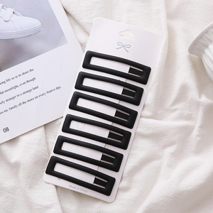 Set of 6 minimalist matte black rectangular BB hair clips on a white display card