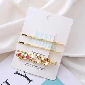 Golden 3-piece hair clip set with colorful crystal rhinestones and hammered texture design