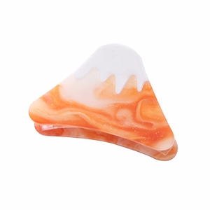 Fuji mountain acetate hair claw with orange marble pattern and glitter detail