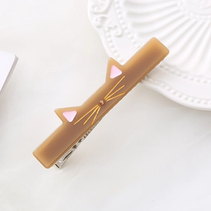 Cute brown cat-shaped acetate hair clip with pink ears and golden whiskers for girls