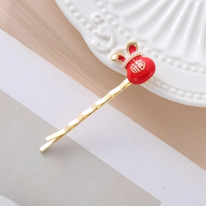 Festive red rabbit bunny hair clip with gold Fu character and pearl accent for New Year