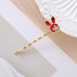 Festive red rabbit hair clip with gold alloy and green flower for Lunar New Year