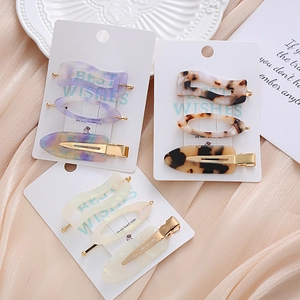 Set of 3 acetate hair clips in marble and tortoiseshell patterns with gold metal base