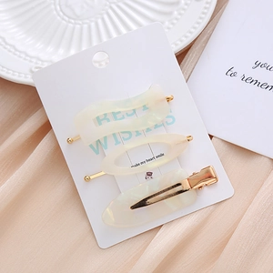 Elegant 3-piece acetate hair clip set with cream marble texture and gold metal base