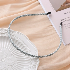 Minimalist narrow headband with green and white gingham fabric on a decorative plate