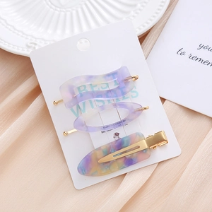 Three-piece acetate hair clip set in purple and marble finish for women styling