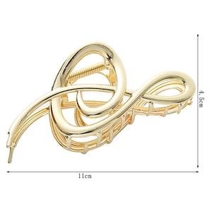 Detail showing 11cm golden musical note metal hair claw clip for women's hairstyle