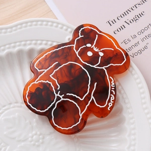 Pince à cheveux ours en acétate avec texture ambre et motif blanc élégant pour femme