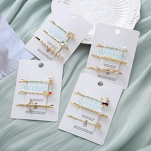Ensemble de barrettes dorées avec perles, strass et formes de cœur pour femme