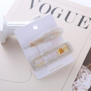Elegant acetate marble hair clip set with cream teardrop and rectangle clips on gold base