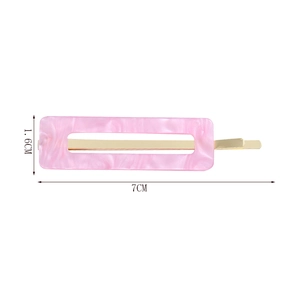 Detailed view of rectangular pink marble pattern hair clip with gold metal base 7x1.6cm