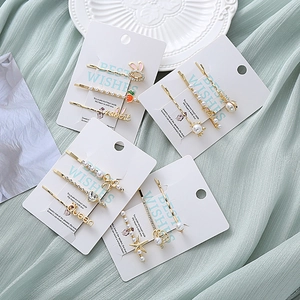 Lot de barrettes dorées avec perles, motifs de lapin et cristaux pour un look élégant
