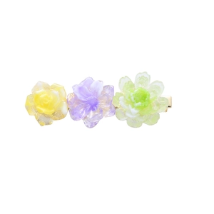 Three-color floral acetate hair clip with yellow, purple, and green gradient resin flowers