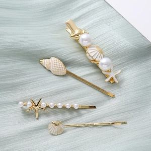 Starfish shell and pearl hair clip set with gold finish for a summer beach look