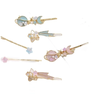 6-piece celestial hair clip set with stars, moons, and planets in pink and blue pastel