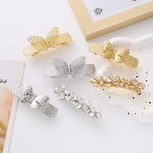 Elegant hollow metal butterfly and rhinestone hair clips in gold and silver finish