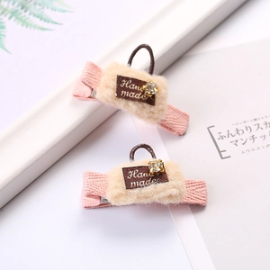 Chic plush fabric duckbill hair clips with mini handbag design and handmade label