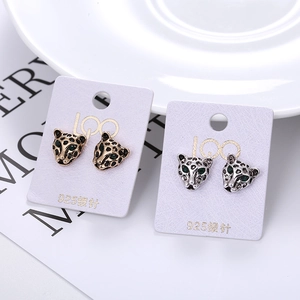 Elegant leopard head stud earrings in gold and silver finish with green gemstone eyes