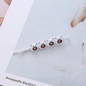 Barrette à cheveux mignonne de style coréen avec quatre ours blancs sur un magazine