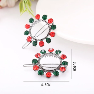Detailed view of silver hair clips featuring bright red and green rhinestones in 4.5cm size