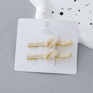 Elegant set of two pearl bowknot hair clips on gift card for women daily hairstyle