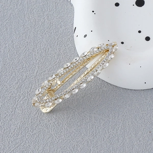 Barrette dorée exquise en forme de feuille avec strass œil-de-chat et détails creux