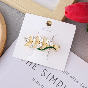 Wheat ear hair clip with green enamel, cat eye stones and pearls on a gold base