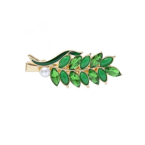 Elegant gold wheat leaf hair clip with green crystals and white pearl accent