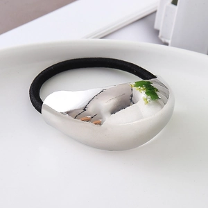 Minimalist elastic hair tie with a polished irregular silver metal bean decoration