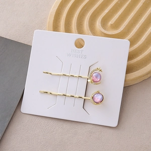 Starry galaxy gold hair clips set with purple aurora beads and celestial charms