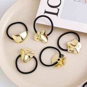 Set of 5 elastic hair ties with gold star, heart, and geometric metal ornaments
