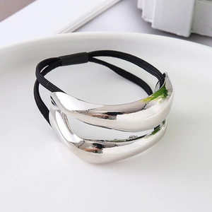 Detail of silver irregular double-layer metallic hair tie with black elastic band