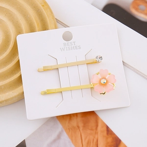 Elegant gold cherry blossom hair clips with pink acrylic flowers and rhinestones set