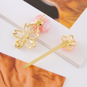 Elegant cherry blossom hair clips set with pink petals and golden finish for women