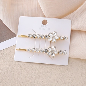 Elegante juego de pinzas para el cabello con flores de cristal y acabado dorado para mujer