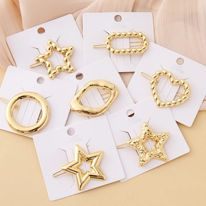 7-piece minimalist geometric gold hair clip set with star heart and polished metal finishes
