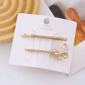 Elegant gold butterfly hair clip set with sparkling rhinestones and white pearls