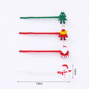 Detailed view of Christmas hair clips showing dimensions 5.8cm by 1.6cm with 4 styles