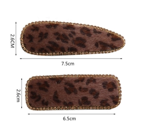 Detail view of velvet leopard print BB hair clips with gold rhinestones and dimensions