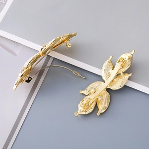 Elegant gold leaf hair clips with white pearls, set of two minimalist fashion accessories