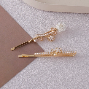 Exquisite gold-plated hair clips with delicate rose flowers and white faux pearls