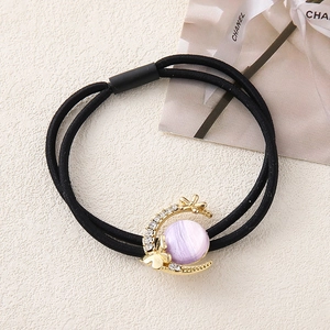 Elegante elastico per capelli con ciondolo a luna dorata, pietra viola e strass lucenti