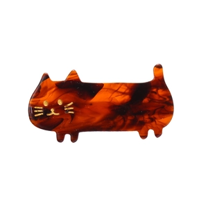 Cute amber tortoiseshell cat hair clip with golden facial details and minimalist design