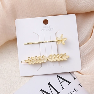 Set di fermagli per capelli dorati con pietre occhio di gatto e design floreale